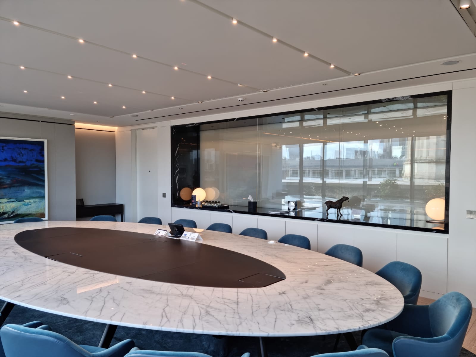 Boardroom showcasing privacy glass partition with adjacent walkway, off position