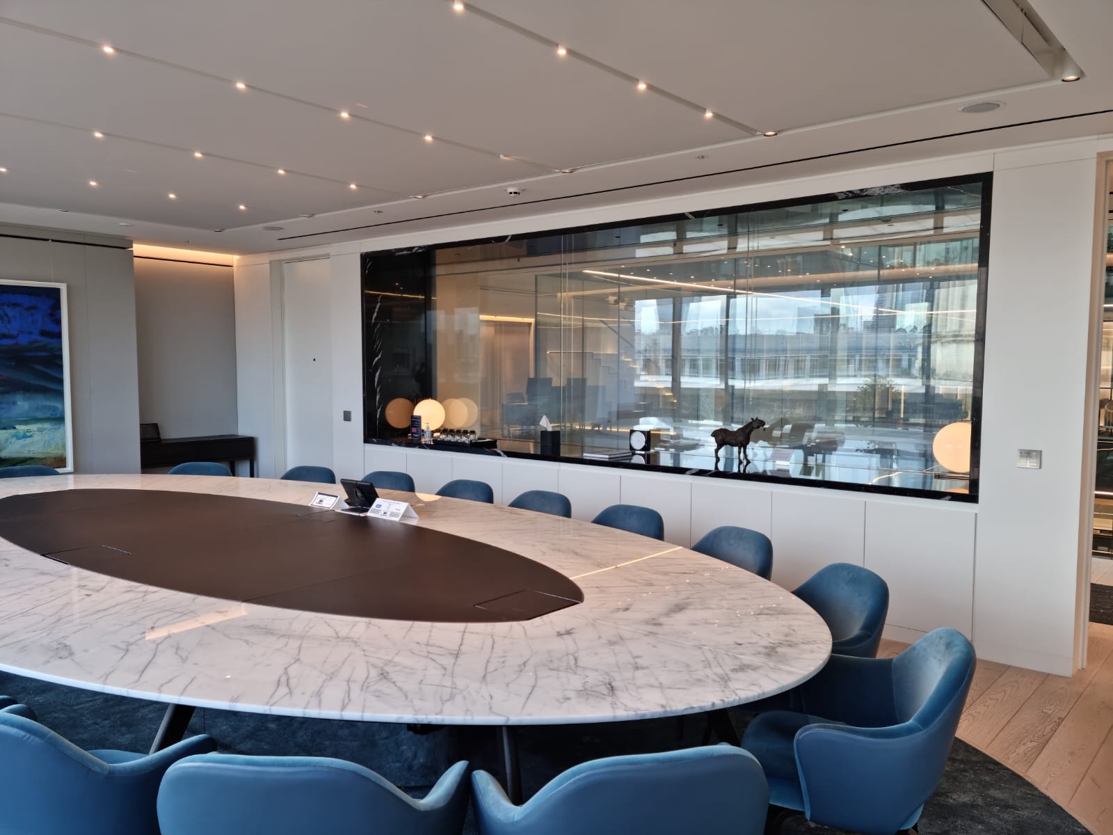 Boardroom showcasing privacy glass partition with adjacent walkway, on position