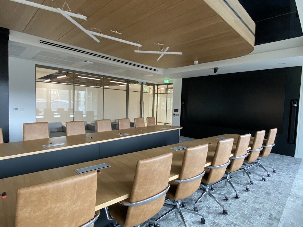 banded switchable glass partitioning in an office meeting room, 'off' position, view from inside room