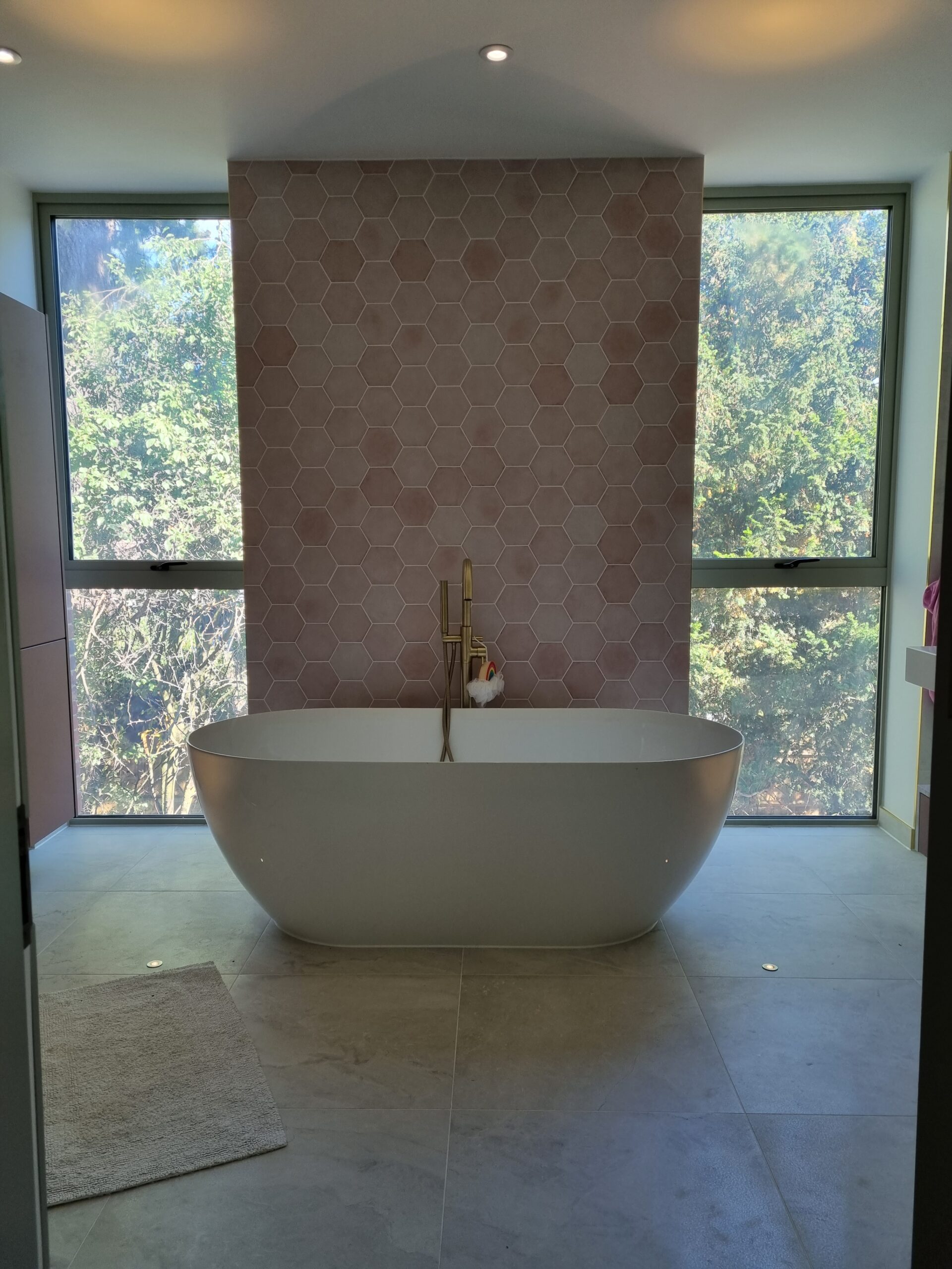 Privacy smart glass is utilized in two bathrooms located in Oxfordshire, England, allowing for immediate privacy with a flick of a switch.