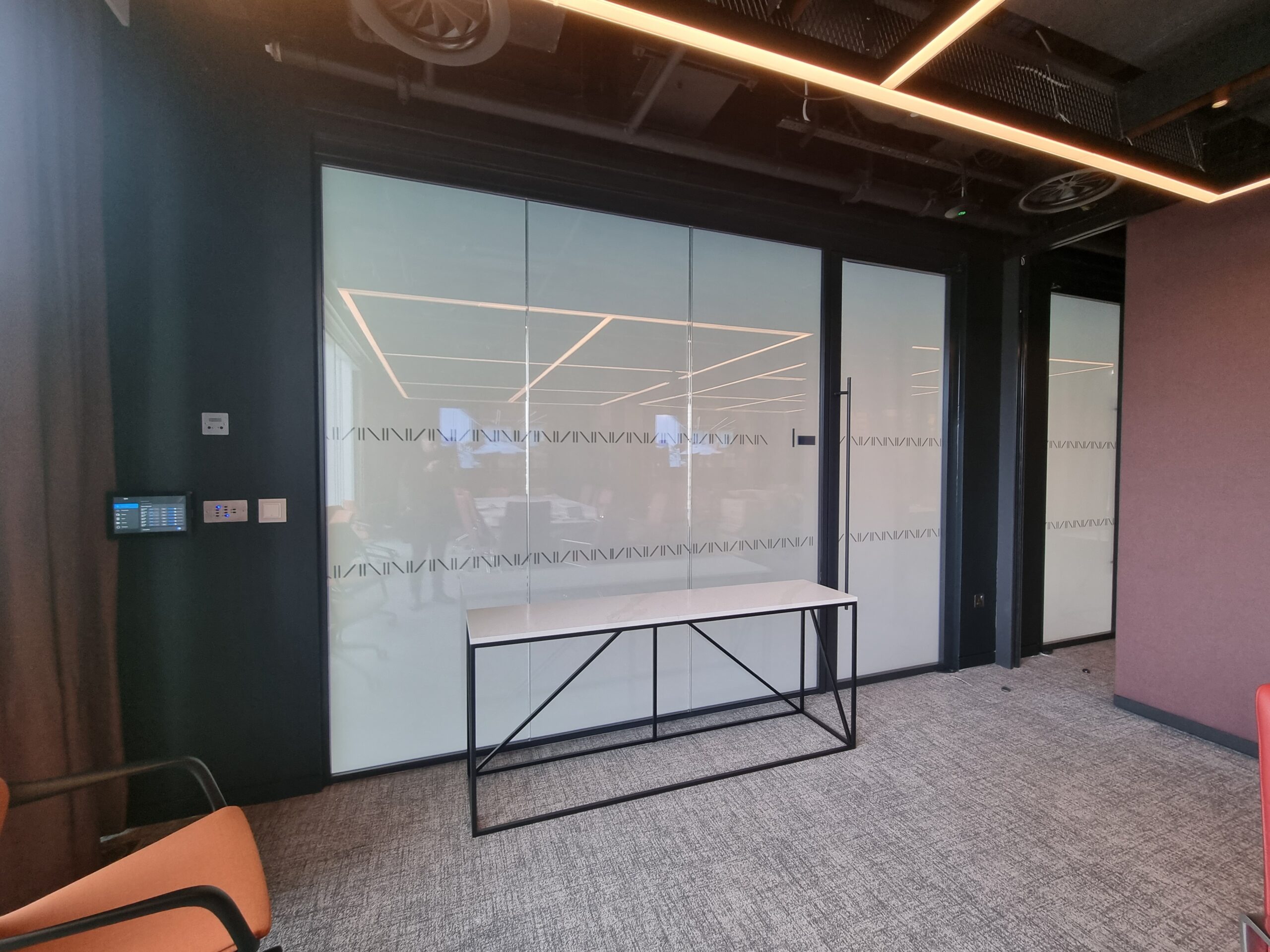 Switchable privacy glass transforms a London office into a stylish open-plan space to maximise natural light.