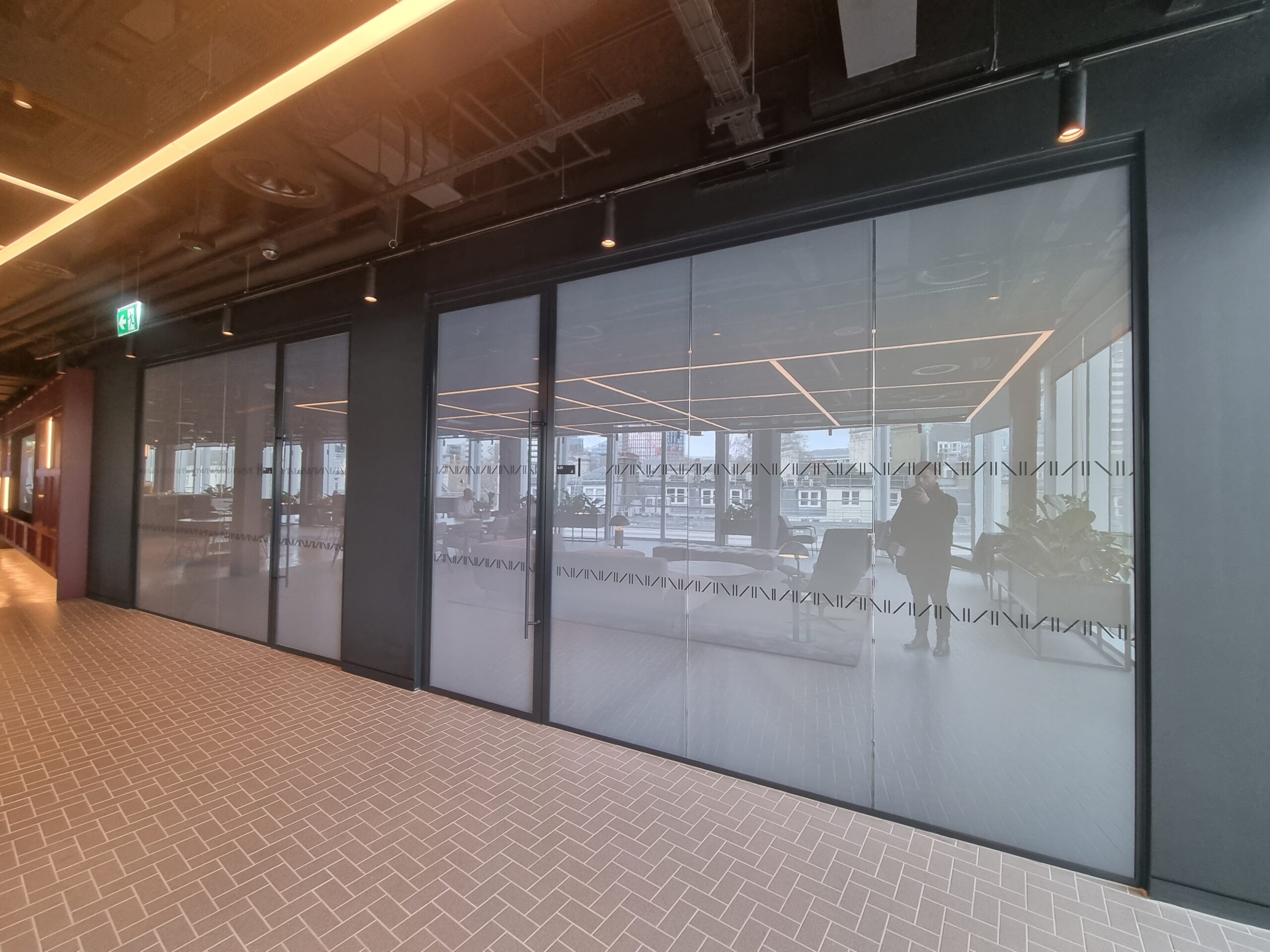 Switchable privacy glass transforms a London office into a stylish open-plan space to maximise natural light.