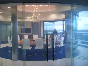 An image of curved doors made out of switchable glass.